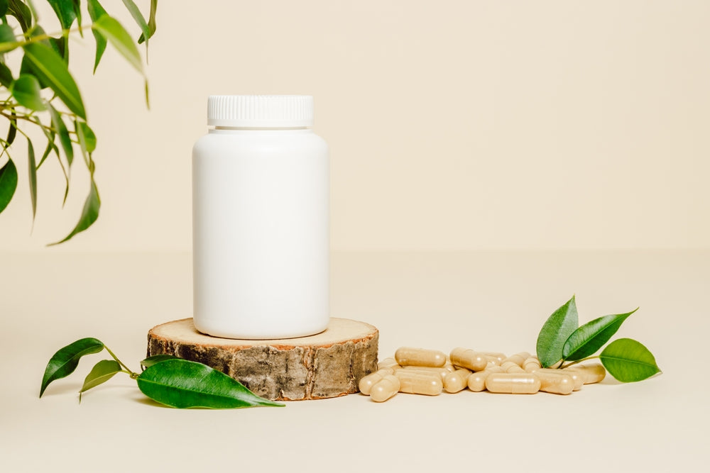 White pill bottle and all natural supplements